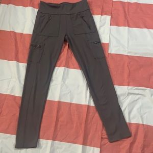 Dark grey leggings with 4 zipper pockets.